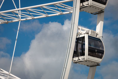 Low angle view of ferris wheel against sky