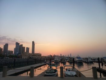 Scenic view of buildings against sky during sunset