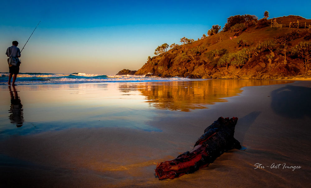 SCENIC VIEW OF SUNSET OVER SEA