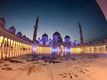 Panoramic view of illuminated building against sky