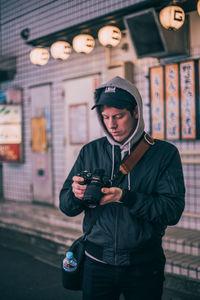 Portrait of young man using mobile phone