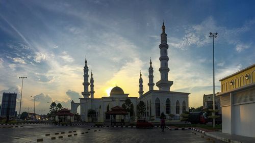 View of mosque / buildings in city against sky