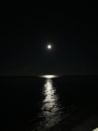 Scenic view of sea against sky at night