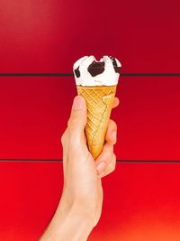 Close-up of hand holding ice cream