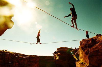 Low angle view of jumping jumping in sky