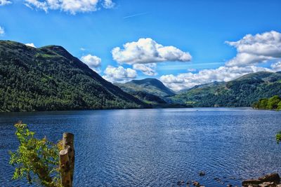 Scenic view of lake and mountains against sky