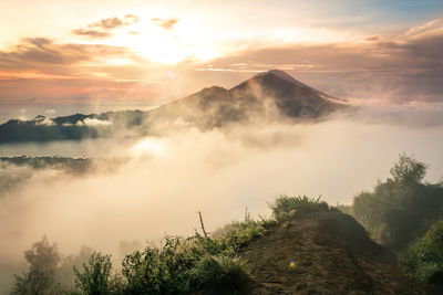 Scenic view of mountains against sky during sunset