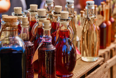 Close-up of wine bottles on table