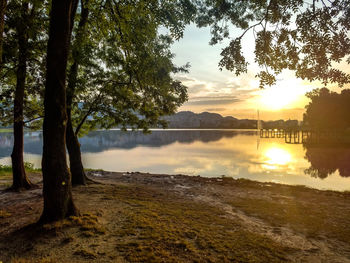 Scenic view of lake against sky during sunset