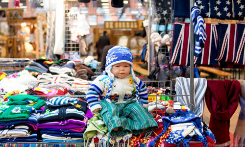 Full length of baby at market stall