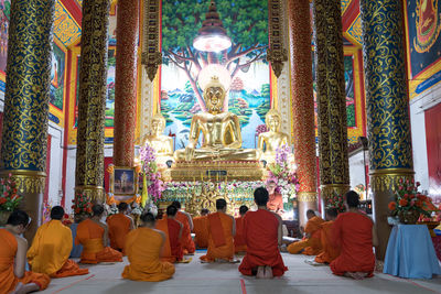 Group of people in temple outside building