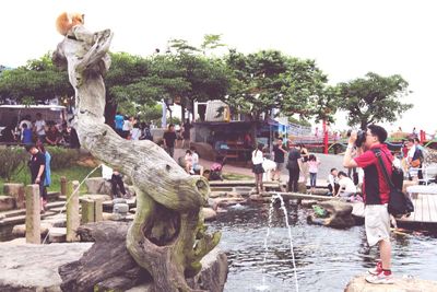 Statue of woman in pond