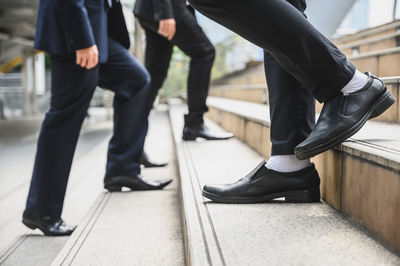 Low section of people standing on floor