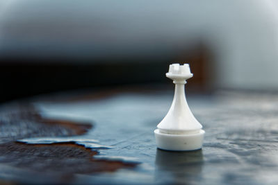 Close-up of chess pieces on table