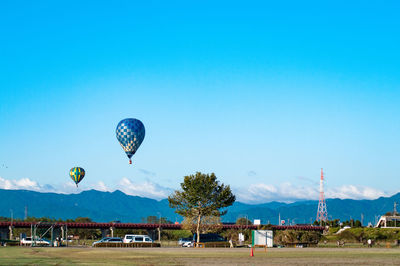Scenic view of field against blue sky