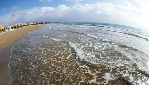 Scenic view of beach against sky