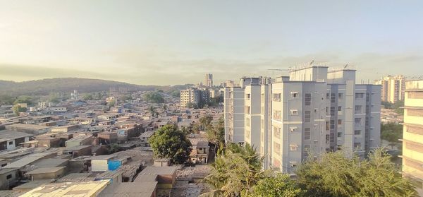 High angle view of buildings in city against sky