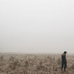 Woman standing on field