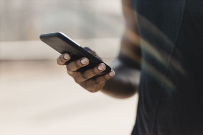 Man using mobile phone outdoors