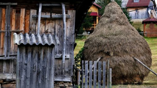 Panoramic view of wooden fence and building