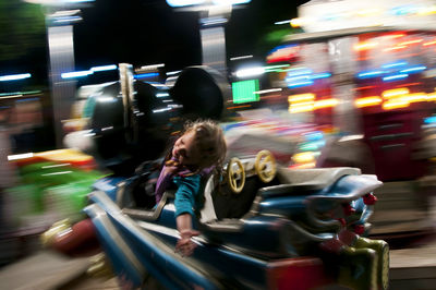 Blurred motion of people at amusement park