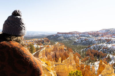 Rear view of woman standing on mountain against clear sky bryce canyon national park 