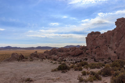 Rock formations in desert against sky