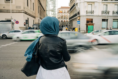 Rear view of man on city street