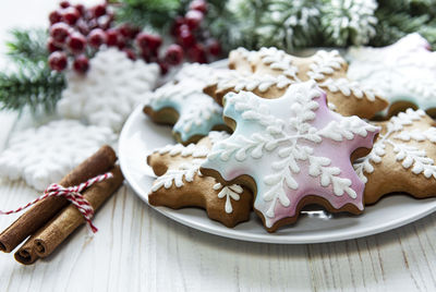 Christmas gingerbread in the plate and holiday decorations