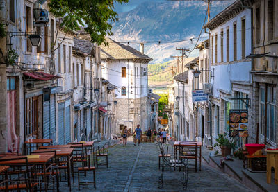 Empty street amidst buildings in city