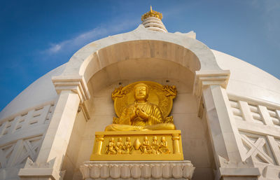 Buddhist stupa isolated with amazing blue sky from unique perspective