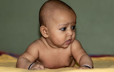 Baby infant cute innocent facial expression with blurred background