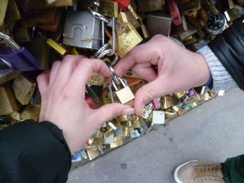 Close-up of hands holding metal