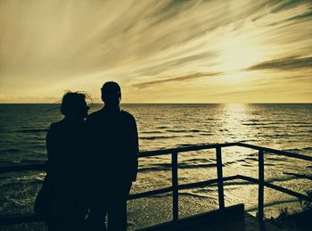 Silhouette of people at sunset