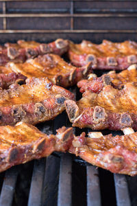 High angle view of meat on barbecue grill