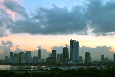 Cityscape against sky during sunset