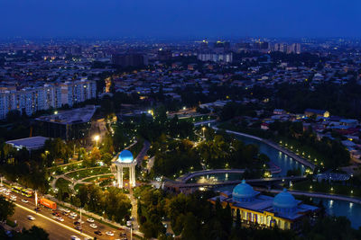 High angle view of illuminated buildings in city at night