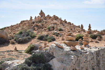 Rock formations on land against sky