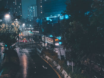 High angle view of illuminated buildings in city at night