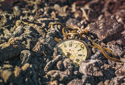 Close-up of clock on stone wall