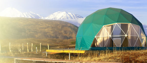 Green geo-dome tent on kamchatka peninsula. cozy, camping, glamping, holiday, 