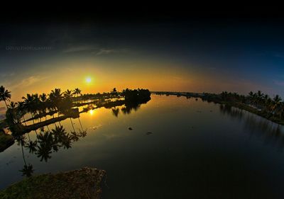 Scenic view of sunset over river