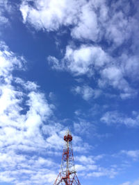 Low angle view of communications tower against sky