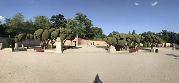Panoramic view of park against blue sky