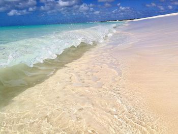 Scenic view of beach against sky