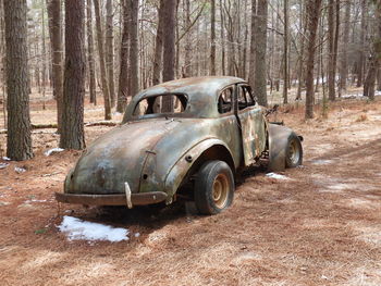 Abandoned car in forest