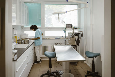 Young female nurse working in veterinary clinic