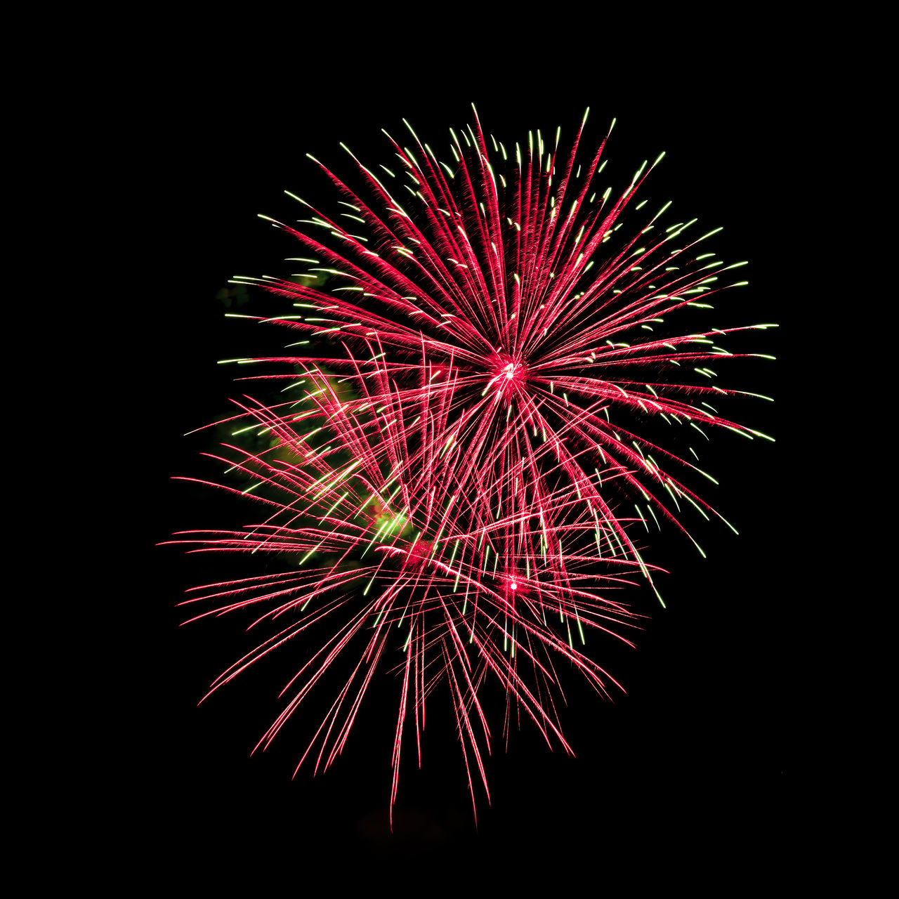 fireworks, celebration, firework display, exploding, motion, event, night, illuminated, arts culture and entertainment, glowing, no people, firework - man made object, recreation, multi colored, sky, red, nature, long exposure, low angle view, blurred motion, dark, black background, black, copy space, outdoors