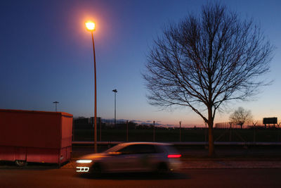 Cars on road at dusk