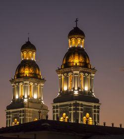 View of illuminated building against sky at night